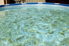 an empty swimming pool with clear blue water