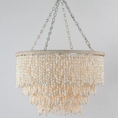 a chandelier made out of beads hanging from a chain