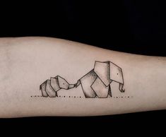 an elephant family tattoo on the arm