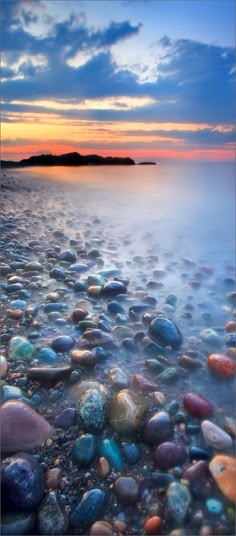 the beach is covered with rocks and water