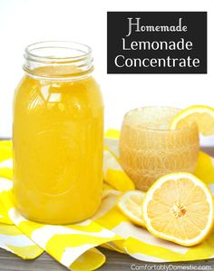 homemade lemonade concentrate in a mason jar next to sliced oranges