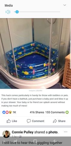 an image of a baby bathtub in the middle of a room with pictures on it