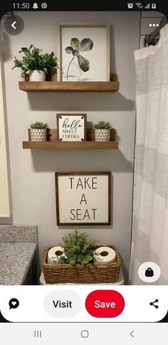 a bathroom with two shelves above the toilet and plants on the shelf next to it