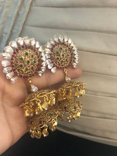 Complete your look this festive season with our beautiful dubble layer jhumka earrings with semi precious ruby and emerald stones and kundan work. A gorgeous pair of jhumka earrings to light up your day any time! In stock and ready to ship. Festive Brass Jhumkas, Festive Dual-tone Gold Jhumkas, Hand-set Cubic Zirconia Jhumkas For Celebrations, Traditional Dual-tone Metal Jhumkas, Traditional Hand-set Dangle Jhumkas, Pakistani Earrings, Braid Accessories, Kundan Earrings, Pakistani Jewelry