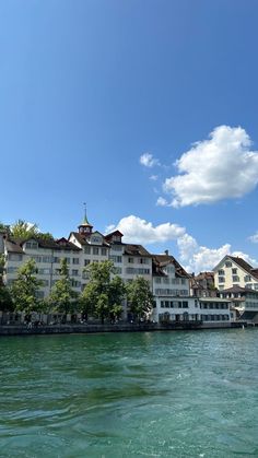 an apartment building on the edge of a body of water