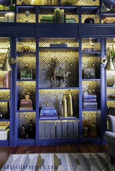 a blue bookcase with many books on it