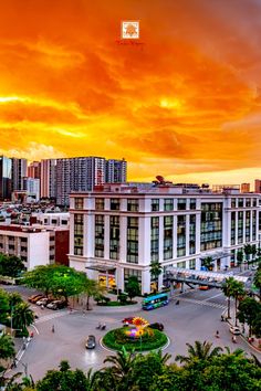 an aerial view of a city at sunset