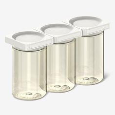 three empty containers with lids on each side