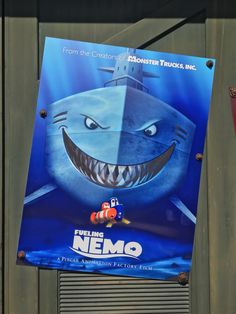 a movie poster hanging on the side of a building with an image of a shark