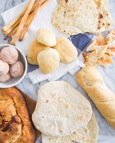 bread, rolls and other food items on a table