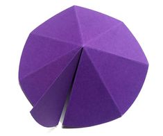 an origami ball on a white background with the top half cut out to show it's inner surface