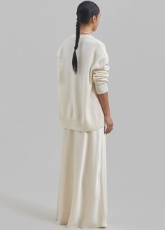 Color: Cream Midweight satiny fabric Slim fit Maxi length A-line silhouette Elasticated waist Slip on style Unlined 100% Polyester Dry Clean By The Frankie Shop. Imported Maxi Satin Skirt, White Skirt Set, The Frankie Shop, Frankie Shop, Satin Skirt, White Skirts, Skirt Set, A Line, Dry Clean