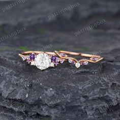 Moissanite engagement ring set Rose gold vintage ring Unique Diamond Amethyst Tanzanite wedding ring Anniversary Promise gift for women ◆RING DETAILS: Engagement ring: Main Stone: Stone: Moissanite Shape: Round cut 6.5mm Accent Stones: Stone: Moissanite & Amethyst & Tanzanite or Natural Diamonds & Amethyst & Tanzanite Shape: Round cut Stone weight: About 0.2ct ◆Band Width:1.4mm ◆Band Thickness:1.2mm Wedding band: Stone: Moissanite & Amethyst & Tanzanite or Natural Diamonds & Amethyst & Tanzanite Shape: Round cut Stone weight: About 0.071ct ◆Band Width:1.3mm ◆Band Thickness:1.2mm All ring sizes are available, If you can't find your ring size in the list, please feel free to contact me. Metal Choice: 14K/18K Yellow Gold, White Gold, Rose Gold are available. Other Metals and Gemstones are als Purple Engagement Rings, Purple And Gold Wedding, Pink Diamonds Engagement, Gold Vintage Ring, Pretty Engagement Rings, Amethyst Wedding, Ring Inspo, Moissanite Engagement Ring Set, Unique Rings Vintage