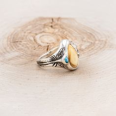 Introducing our new line of Elk Tooth (elk ivory) "Lost Wax Casting" rings! This custom hand-carved design features elk tooth with a beautiful turquoise accent, but it could feature anything you request! Additional wood and inlay options are available upon request. Each ring is hand-carved by our in-house artist, Kevin Fredrickson, and set using an ethically collected elk tooth. Available in: SILVER We love taking on custom orders. If you have your own idea for a design reach out to us in the co Wax Casting Rings, Lost Wax Casting Rings, Elk Ivory, Hand Carved Ring, Tooth Ring, Staghead Designs, Titanium Wedding Band, Turquoise Accents, Ceramic Rings