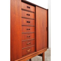 a large wooden cabinet with many drawers