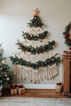 three christmas trees are decorated with red and gold ornaments, while one is hanging on the wall