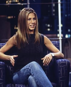 an image of a woman sitting in a chair on the tonight show talking to someone