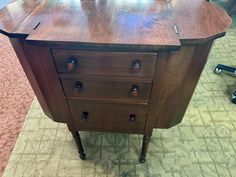 an old wooden dresser sitting on the floor