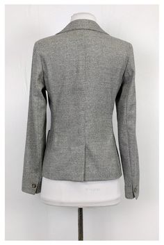 Classic blazer in a wool blend fabric. Its grey color will pair well with neutrals. A great garment for the office. Size 8 70% wool, 15% nylon, 14% silk, 1% elastane Button closure on front Collar Long sleeve Front pockets Buttons on sleeves Bust 34.5" Waist 31" Shoulder to hem 23.5" Gray Fitted Blazer With Suit Collar, Fitted Gray Blazer With Suit Collar, Fitted Gray Blazer With Welt Pockets, Fitted Single Breasted Gray Blazer, Fitted Single-breasted Gray Blazer, Gray Fitted Blazer With Notch Lapel, Fitted Gray Blazer With Notch Lapel, Fitted Gray Single-breasted Blazer, Fitted Gray Blazer With Single Button