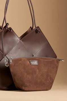 Leather Removable top zip pouch Tie closure Imported | Taylor Contexture Leather Bag by Bob Oré in Brown, Women's at Anthropologie Designer Leather Shoulder Pouch, Designer Leather Top Handle Pouch, Modern Brown Shoulder Bag With Zipper Pouch, Luxury Everyday Shoulder Bag With Zipper Pouch, Luxury Leather Bucket Bag With Zipper Closure, Luxury Leather Shoulder Bag Pouch, Modern Brown Pouch With Zipper Closure, Leather Bucket Bag With Zipper Closure And Top Handle, Leather Bucket Bag With Zipper And Top Handle