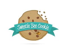 a cookie with a blue ribbon around it and the words sweetie bee cookie above it