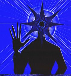 the silhouette of a man with his hands up in front of him, against a blue background