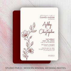 the wedding stationery is designed to look like an elegant floral design, and features red ink