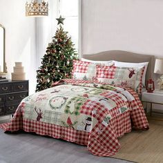 a christmas themed bed spread in a bedroom