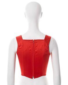 For Sale on 1stDibs - ▪ Vivienne Westwood corset ▪ Sold by One of a Kind Archive ▪ c. 1990s ▪ Constructed from red stretch-satin ▪ Built-in corset boning ▪ Embroidered orb ▪ Red Fitted Top With Boned Bodice, Fitted Red Corset With Boned Bodice, Red Corset With Corset Back For Summer, Fitted Red Corset For Summer, Red Underbust Corset For Summer, Red Sleeveless Boned Bodice Corset, Red Summer Corset With Corset Back, Fitted Red Summer Corset, Summer Red Overbust Corset