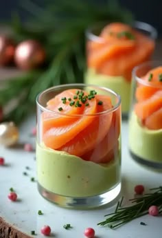 two small glasses filled with food on top of a table