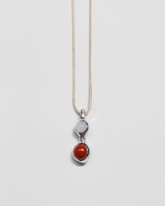 Red jasper and blue chalcedony nestled in a sculptural solid brass or sterling silver setting. Sterling silver chain is adjustable from 18-20 inches, closes with a lobster clasp. Pendant measures 1.25" from top to bottom, just under .5" wide. Availability: Made to order, ships in 2-4 weeks. Need it sooner? Don't hesitate to get in touch and we'll do our best to accommodate. Silver Brass Snake Chain Necklaces, Silver Brass Snake Chain Necklace, Silver Brass Necklace With Snake Chain, Silver Snake Chain Necklace In Brass, Silver Necklaces With Natural Stones In Brass, Unique Red Carnelian Necklaces, Unique Sterling Silver Teardrop Pendant Necklaces, Unique Sterling Silver Teardrop Pendant Necklace, Red Sterling Silver Necklace With Round Pendant