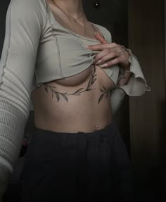 Tatto#Tattoing#Tattooinspiration Vine Tattoo On Stomach, Cross Body Tattoo, Vines Chest Tattoo Female, Sternum Vine Tattoo Women, Curvy Tattoo Design, Small Line Work Tattoos For Women, Lily Of The Valley Chest Tattoo, Above Vag Tattoos, Sternum Vine Tattoo