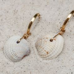 Easy, breezy, and a little bit beachy - the perfect earring when you want better than basics. ABOUT THE NAME Cortez Beach is one of the last remaining fishing villages on Florida's southwest Gulf coast. Just pull off the side of the road and take a quick walk through the tall trees and coastal grasses to the white sand beach. MATERIALS Cross-barred Venus shells on with 14k gold-filled hoops Every stone, shell, and handmade glass piece is unique, which means that each charm is too. You can expect Coastal Grasses, Gold Filled Hoops, Tall Trees, Fishing Villages, Easy Breezy, Shell Earrings, White Sand Beach, Gulf Coast, White Sand