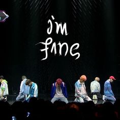 group of people on stage with the words i'm fine