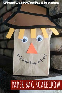 a paper bag scarecrow with the words paper bag scarecrow on it's face