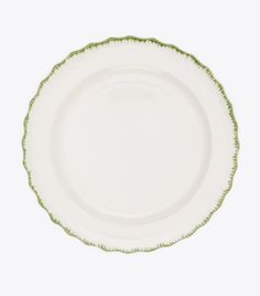 an empty white plate with green trim