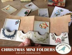 christmas mini folders are displayed on a table with cards and envelopes in the background