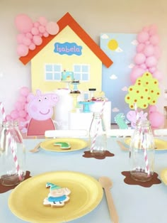 a table set up for peppa pig birthday party