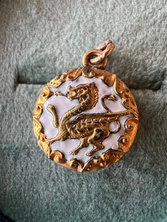 Antique gold tone griffin charm.  Unique and in great condition for its age (estimated to the 1920s).  Measured 1.4 cm in diameter.  This piece is gold TONE, not gold. Heart Padlocks, Chain Styles, Vintage Silver, Antique Gold, Charm Necklace, Gold Tones, Chain Necklace, Handmade Items, Jewelry Necklaces