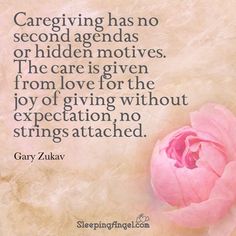 a pink flower sitting on top of a table next to a quote that says, caregiving has no second agendas or hidden motives