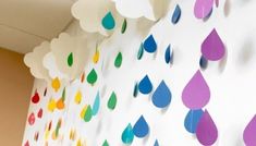 colorful raindrops are hanging on the wall