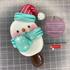 a close up of a snowman with a hat and scarf