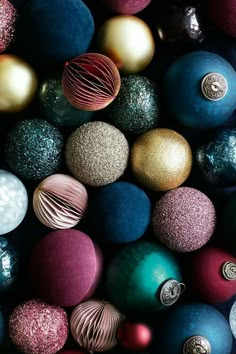 many different colored ornaments are arranged together