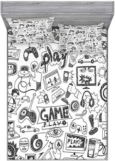 a black and white bed set with game symbols on it