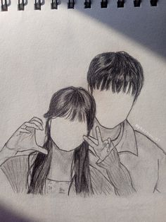 a drawing of two people standing next to each other with their faces drawn on paper