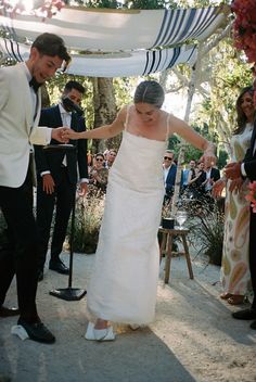 the bride and groom are getting ready to walk down the aisle