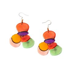 Brighten up your world with these fresh, colorful tagua flower earrings. Inspired by the flora of Ecuador and brought to life by our Ecuadorian artisans. Pair with our Florence Bracelet and Necklace to complete the look. Approximately 2" L Materials: Sustainable Tagua nut Ear wires are hypoallergenic, nickel free, and lead free Organic Vegetable Dyes Handmade in Ecuador Due to the nature and size of the tagua nuts, all sizes are approximate…not exact. Colors may vary from the pictures slightly d Organic Earrings, Summer Clearance Sale, Tagua Jewelry, Tagua Nuts, Organic Vegetables, Short Necklace, Flower Earrings, Earrings Jewelry, Ecuador