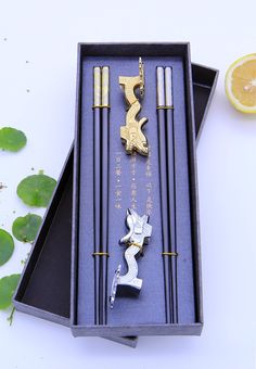 PRICES MAY VARY. ❤ Safe and healthy: Traditional Chinese dragon chopsticks are delicate chopsticks that can only be used by China's supreme emperor. They are made of high-quality heat-resistant fiberglass material. Safe and hygienic, it comes with two dragon-shaped chopstick rests made of zinc alloy material ❤Easy to use: Chinese traditional standard length: 9.4 inches/24 cm, light weight, only 30 grams. The chopstick head is designed with a frosted structure, which will not slide when grasping Chinese Souvenirs, Luxury Chopsticks, Chinese Gift Ideas, Chinese Items, Chinese Luxury, Chinese Chopsticks, Souvenir Wedding, Chinese Gifts, Luxury Gift Set