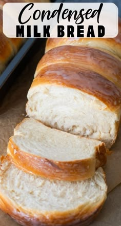 sliced loaf of bread sitting on top of a piece of parchment paper