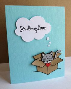 a greeting card with a cat in a box and the words sending love above it